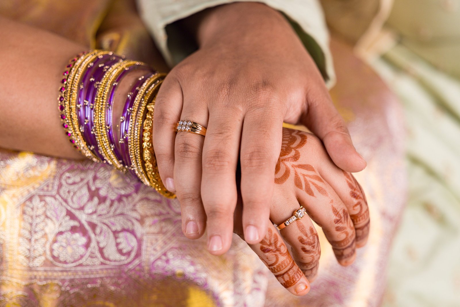 Engagement rings and joined hands